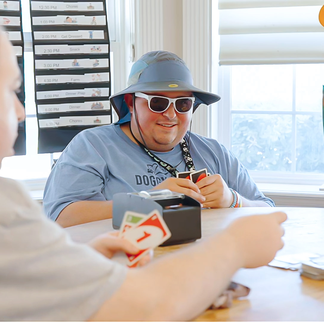 Safe Harbor Resident Playing Cards Adult resident playing cards in one of Safe Harbor’s special needs residential homes.