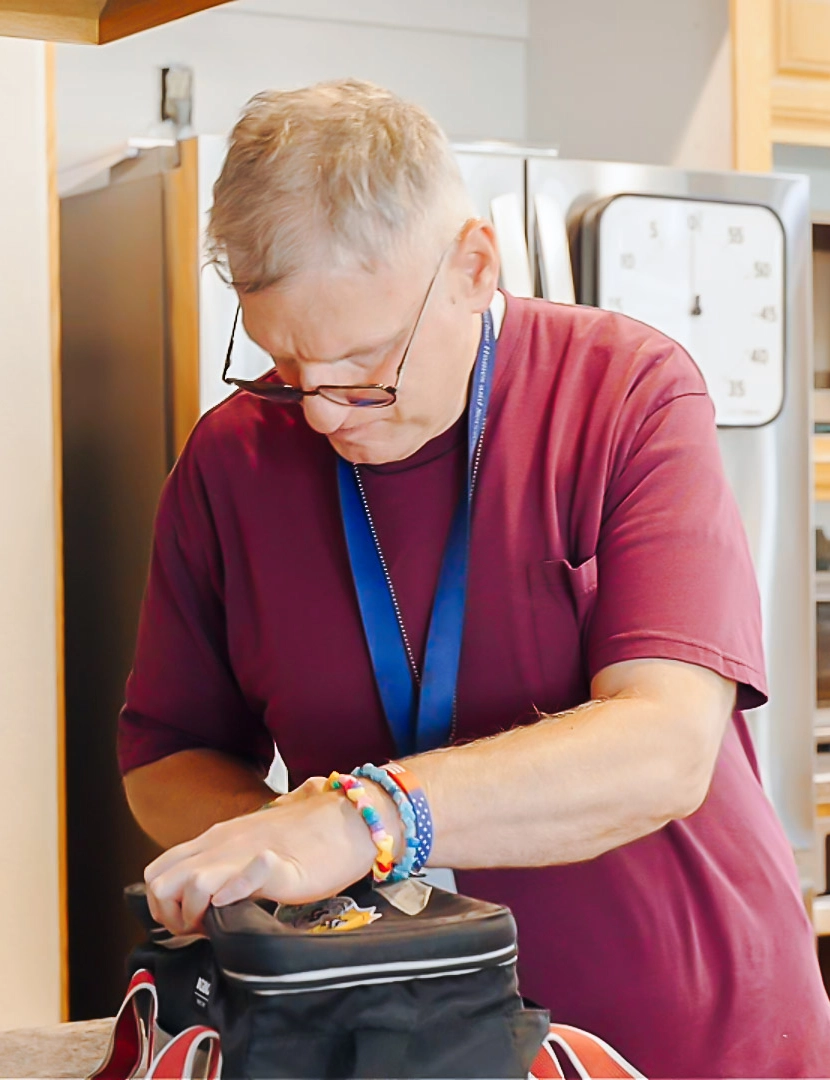 Safe Harbor Residential Care Staff Safe Harbor staff member providing support in a residential home.
